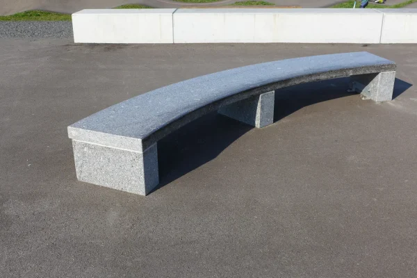 Curved granite bench of the Ruggell Street Skatepark
