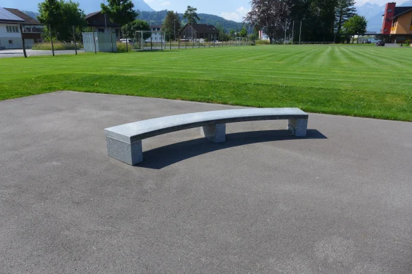 Curved granite bench of the Ruggell Street Skatepark
